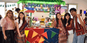 Curtin University Dubai students wearing traditional attire and celebrating global heritage at Ethnic Day stalls.