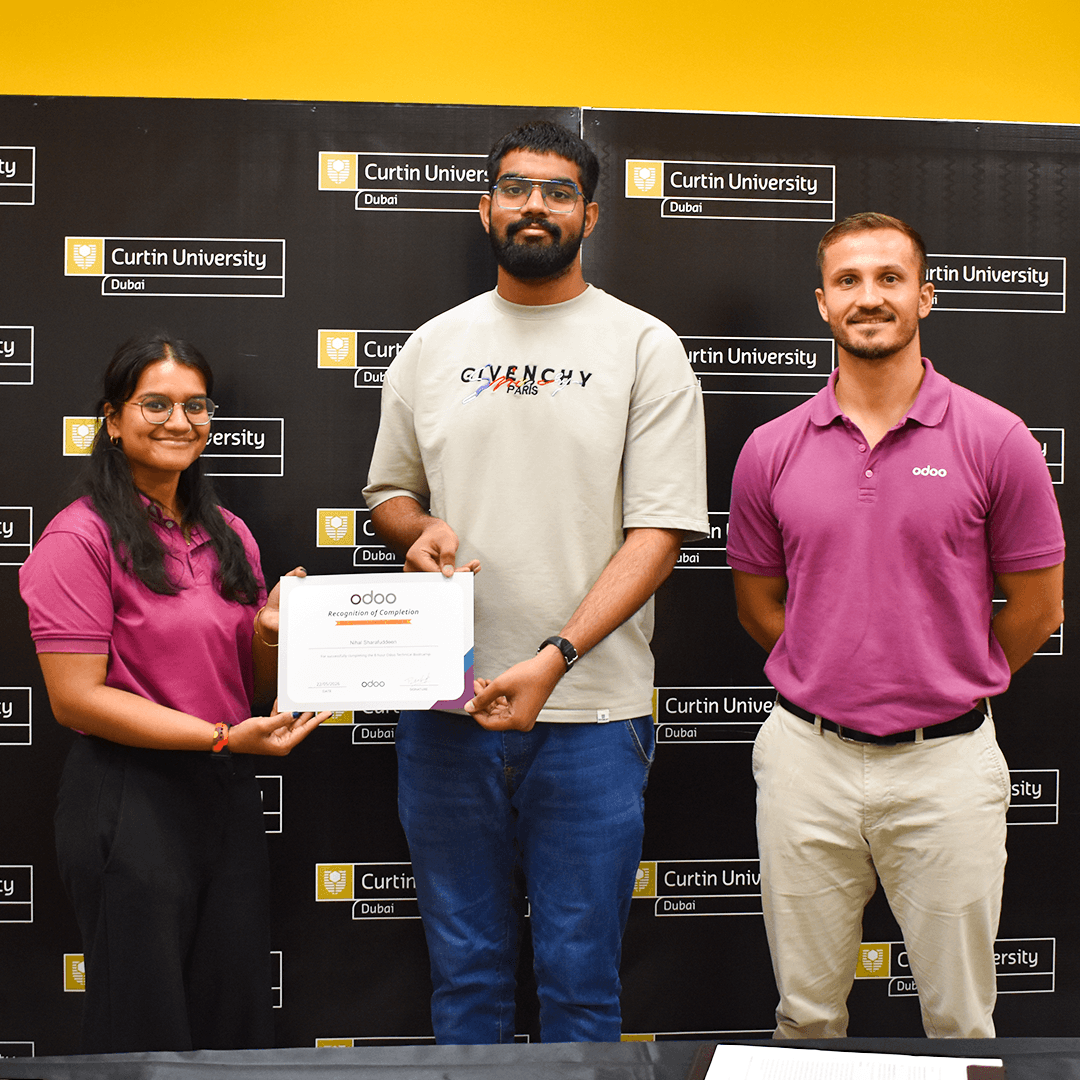 Representatives from Odoo and Curtin University Dubai awarding an industry-recognised certificate to a Curtin Dubai IT student