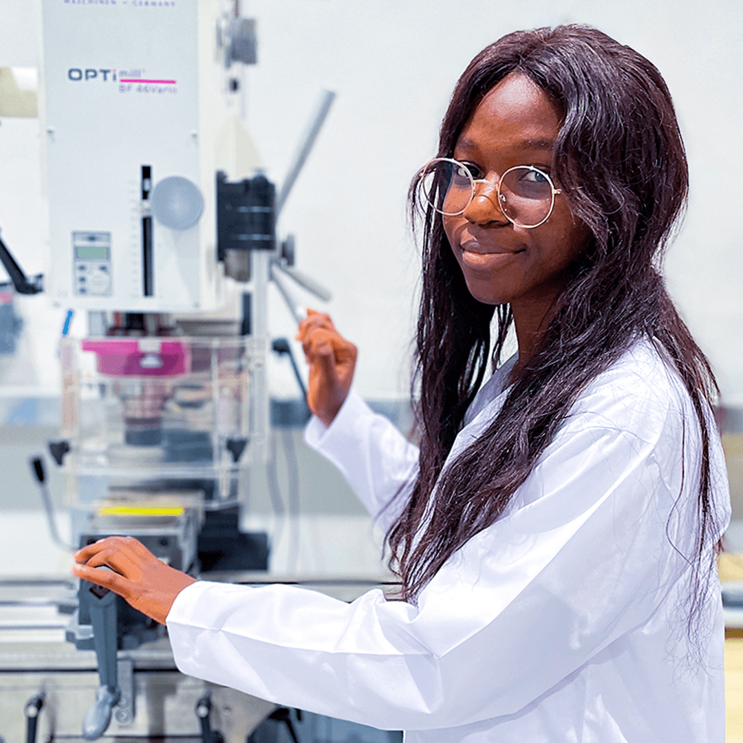 Woman in STEM and Mechanical engineering student using laboratory equipment at Curtin University Dubai