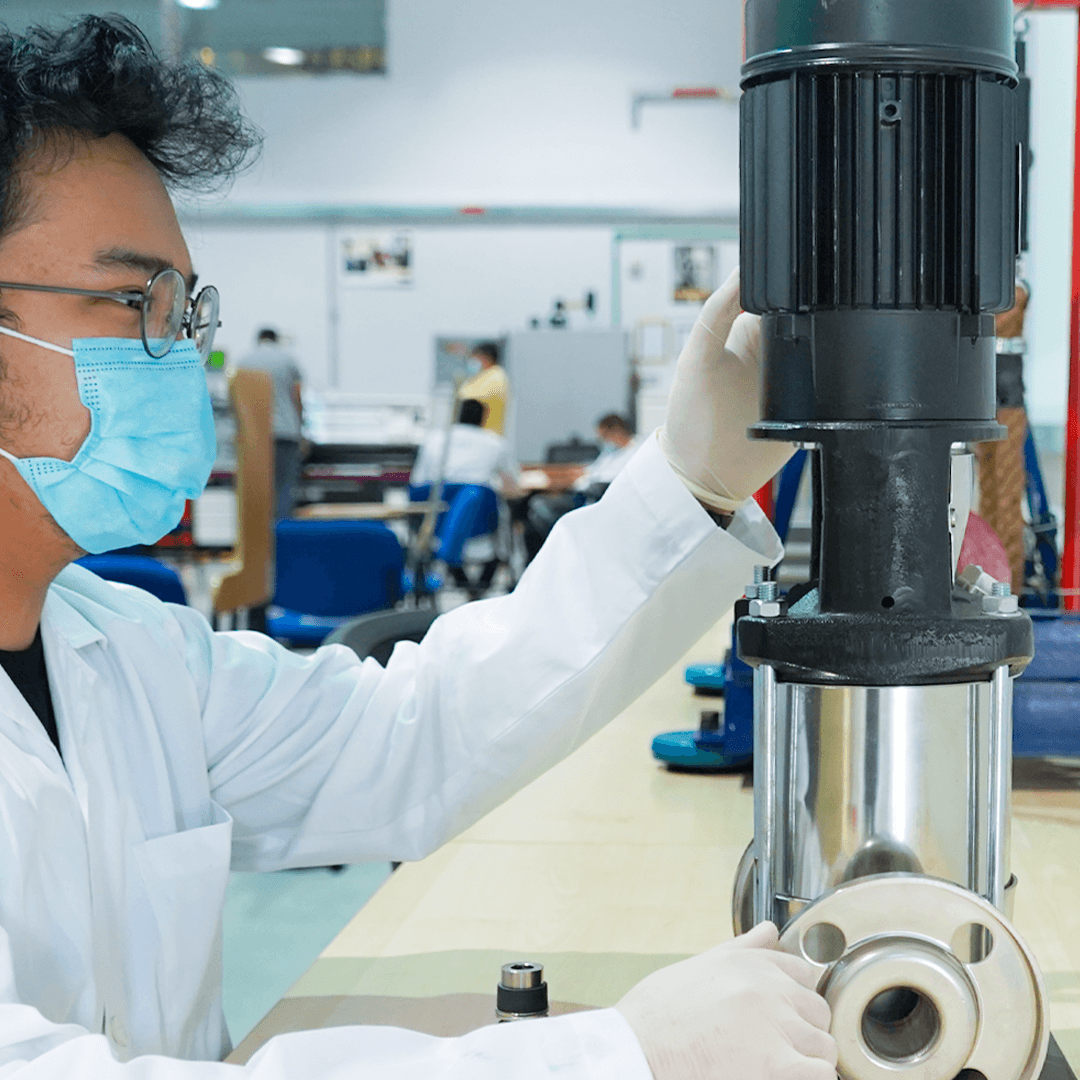 Curtin Dubai engineering student working with mechanical systems and laboratory equipment